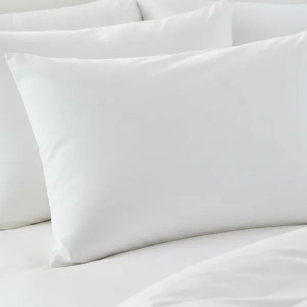 A perfectly clean, white pillowcase, fresh and free of any stains after a successful cleaning process.