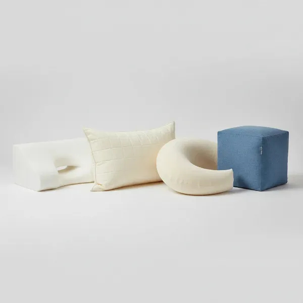 A collection of different pillow shapes designed for side sleepers, including contour, crescent, and cube.
