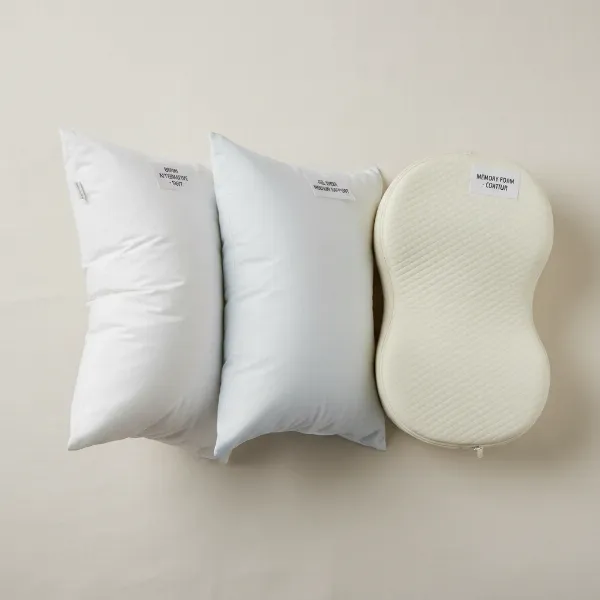 A collection of budget-friendly pillows showcasing different fills like down alternative, gel fiber, and memory foam.