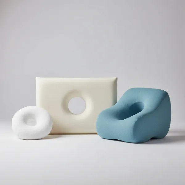 A collage or display of different ear pillow types including donut, square, and contoured shapes.